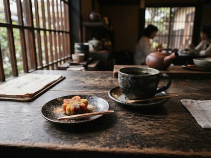 Coffee and seasonal wagashi on an old timber table