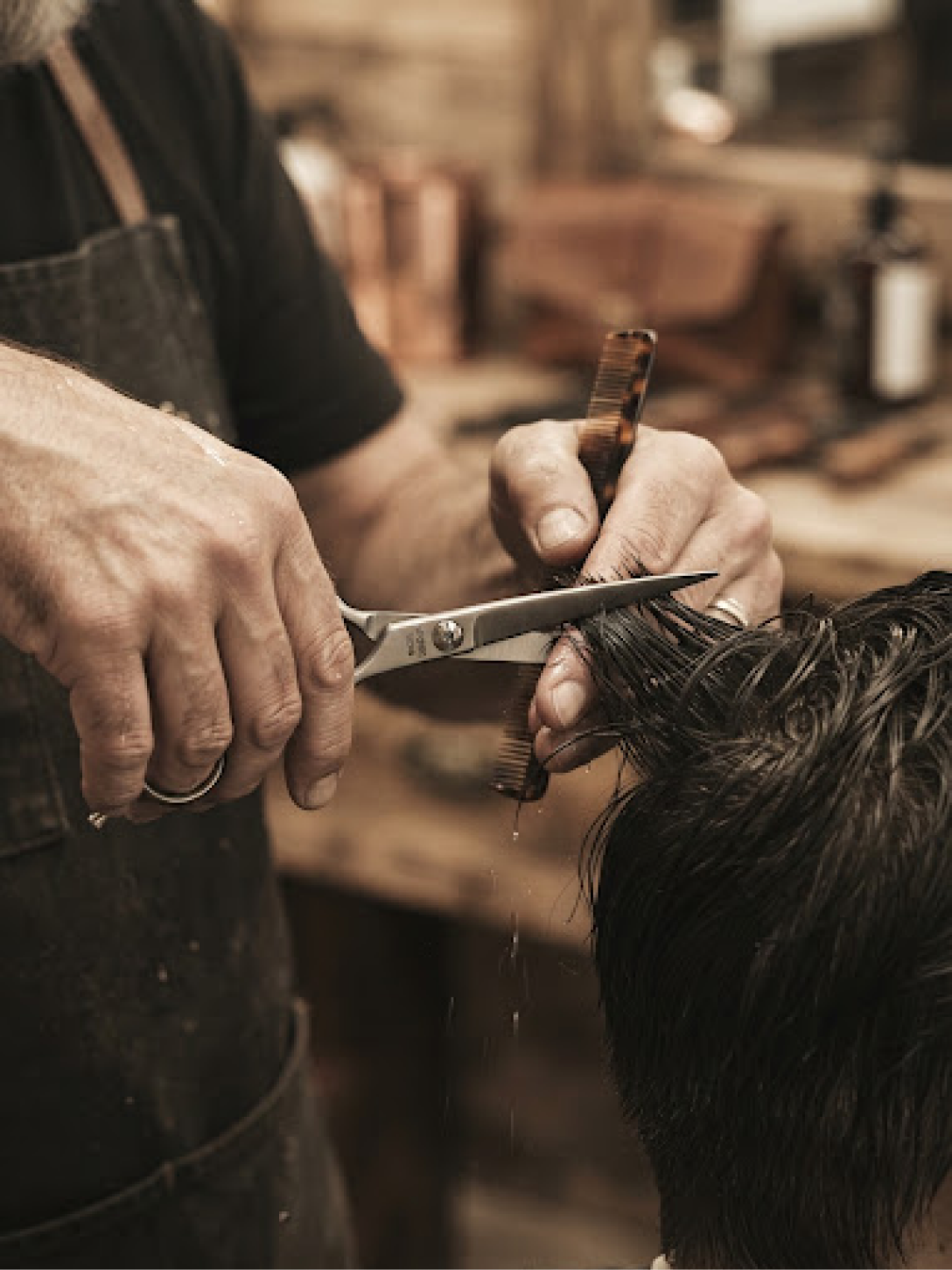 Master barber using Japanese forged shears